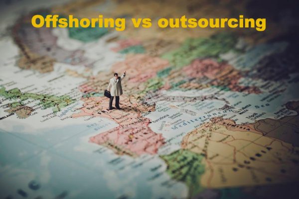 Offshoring vs outsourcing: an illustration with a map and a figurine of a man standing on top of it